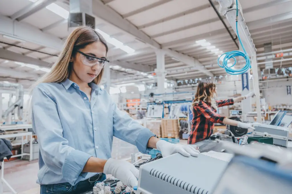Young women working on the production line in factory